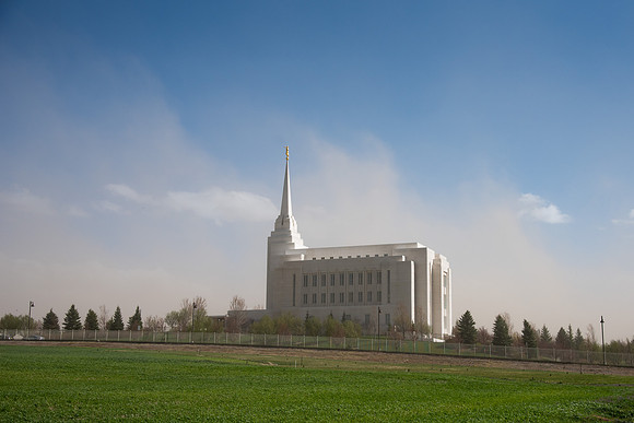 Rexburg Idaho Temple surrounded by dust during a wind storm.