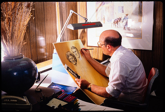 Richard Bird paints a portrait of President and Sister Joe J. Christensen as a keepsake for them.