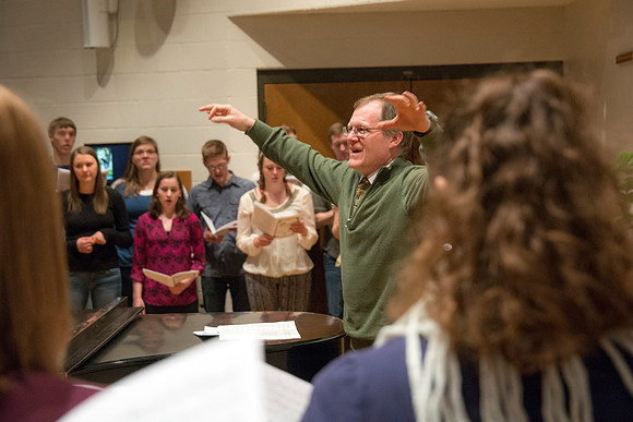 Randall Kempton instructs the talented students who make up the Collegiate Singers at BYU-Idaho.