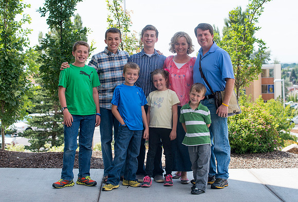 A family gathers for a picture.