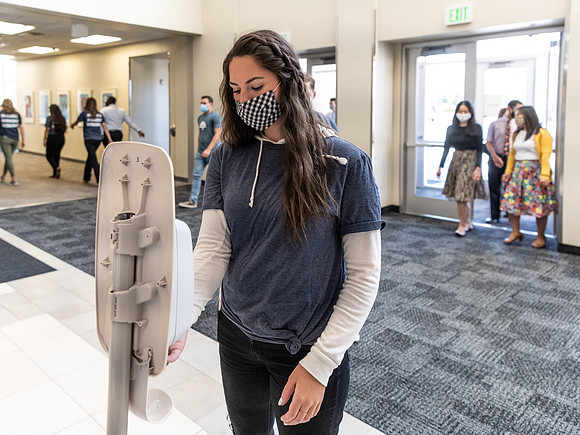 Students use hand sanitizer on campus to stay safe and healthy.
