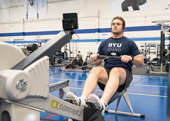 A student using the rowing machine at the Hart Fitness Center.