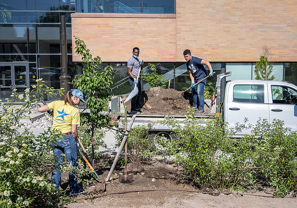Cleaning up the grounds around the STC.