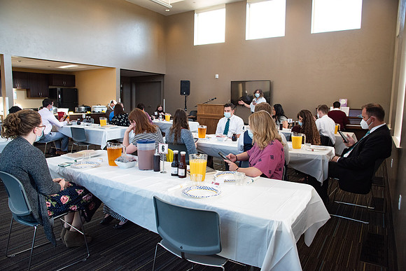 Faculty and Staff of Housing and Student Living gather for an early morning breakfast and an inspirational speaker.