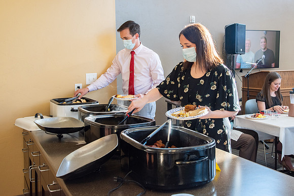 Faculty and Staff of Housing and Student Living gather for an early morning breakfast and an inspirational speaker.