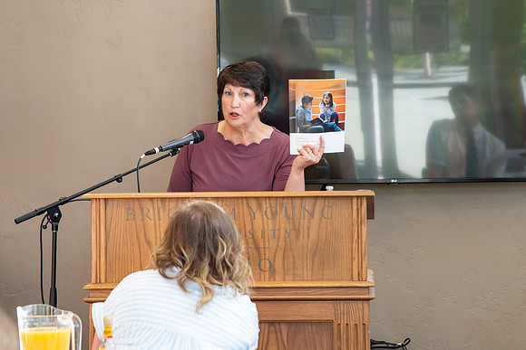 Faculty and Staff of Housing and Student Living gather for an early morning breakfast and an inspirational speaker.