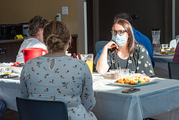 Faculty and Staff of Housing and Student Living gather for an early morning breakfast and an inspirational speaker.