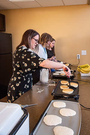 Faculty and Staff of Housing and Student Living gather for an early morning breakfast and an inspirational speaker.