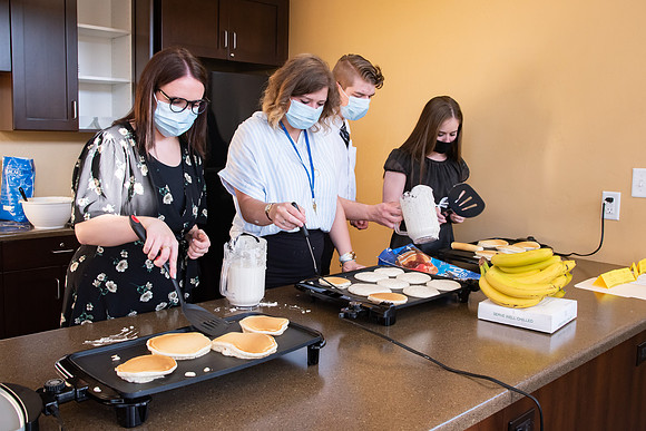 Faculty and Staff of Housing and Student Living gather for an early morning breakfast and an inspirational speaker.