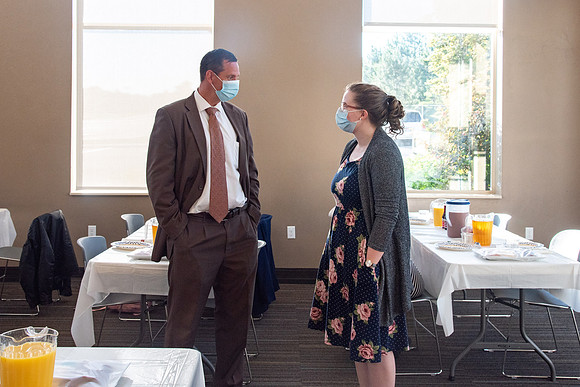 Faculty and Staff of Housing and Student Living gather for an early morning breakfast and an inspirational speaker.