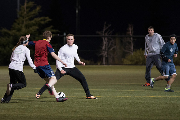 Co-Ed Intermediate Soccer teams play game.