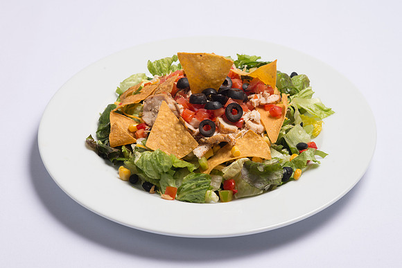 BYU-Idaho Food Service Catering. Southwest Salad Fresh mixed Salad Greens, topped with marinated sliced Chicken Breast, chopped Vegetables, Tomatoes, shredded Cheddar Cheese and Tortilla Chips. Served