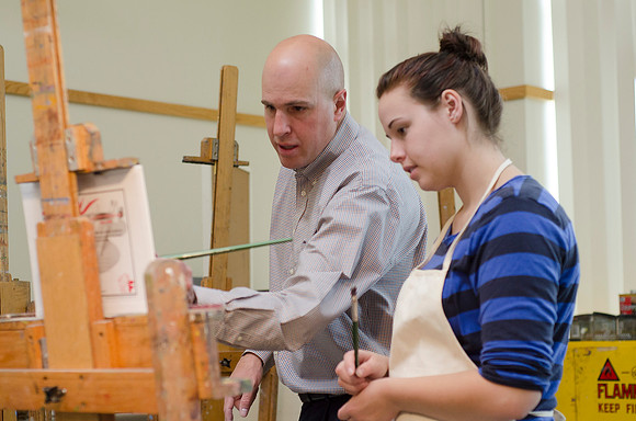 David Belka enthusiatically teaches painting principles to beginning painting class.