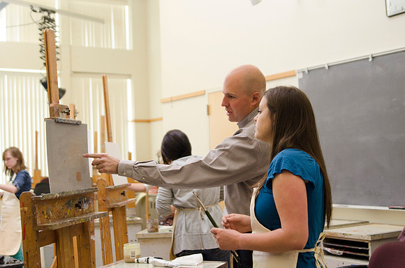 David Belka enthusiatically teaches painting principles to beginning painting class.