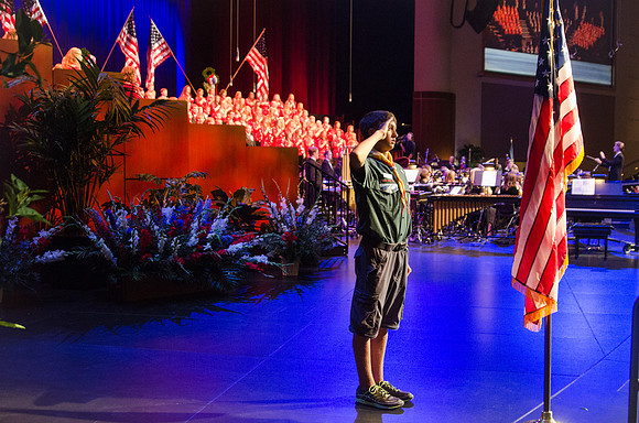 Members of the Collegiate Singers, Men's Choir, Women's Choir, and Symphony Band all perform together at the Patriots and Pioneers Concert.