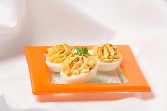 Filled with the hard-bolied egg yolk, mixed with mayonnaise and mustard.