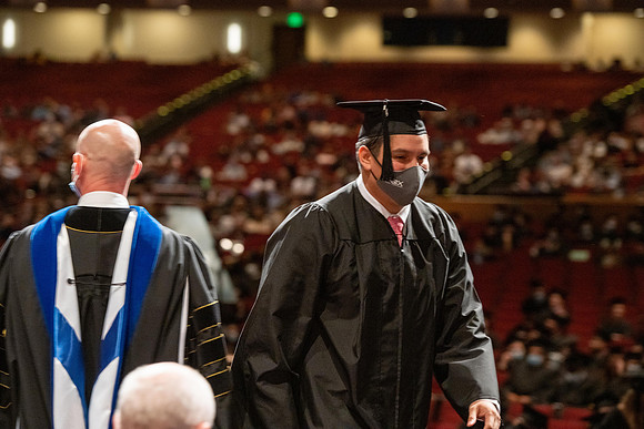 Combined Convocation for the College of Business & Communication and also the College of Physical Sciences & Engineering. Graduates receive their diploma covers.