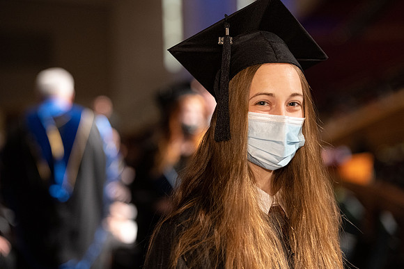 Combined Convocation for the College of Business & Communication and also the College of Physical Sciences & Engineering. Graduates receive their diploma covers.