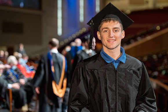 Combined Convocation for the College of Business & Communication and also the College of Physical Sciences & Engineering. Graduates receive their diploma covers.