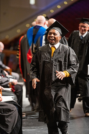 Combined Convocation for the College of Business & Communication and also the College of Physical Sciences & Engineering. Graduates receive their diploma covers.