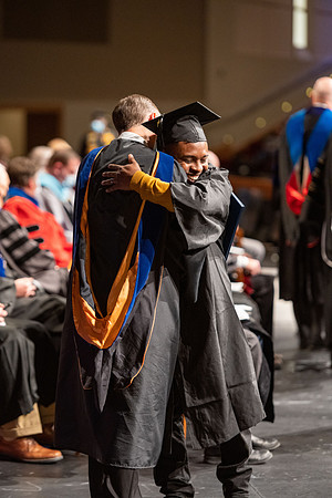 Combined Convocation for the College of Business & Communication and also the College of Physical Sciences & Engineering. Graduates receive their diploma covers.