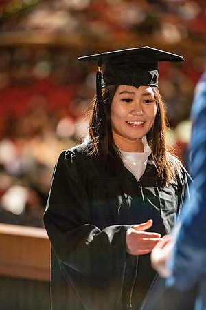 Combined Convocation for the College of Business & Communication and also the College of Physical Sciences & Engineering. Graduates receive their diploma covers.