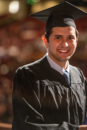 Combined Convocation for the College of Business & Communication and also the College of Physical Sciences & Engineering. Graduates receive their diploma covers.