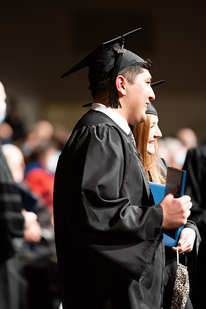 Combined Convocation for the College of Business & Communication and also the College of Physical Sciences & Engineering. Graduates receive their diploma covers.