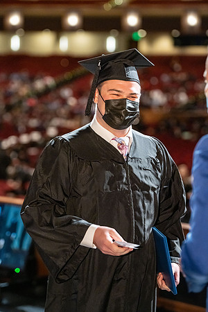 Combined Convocation for the College of Business & Communication and also the College of Physical Sciences & Engineering. Graduates receive their diploma covers.
