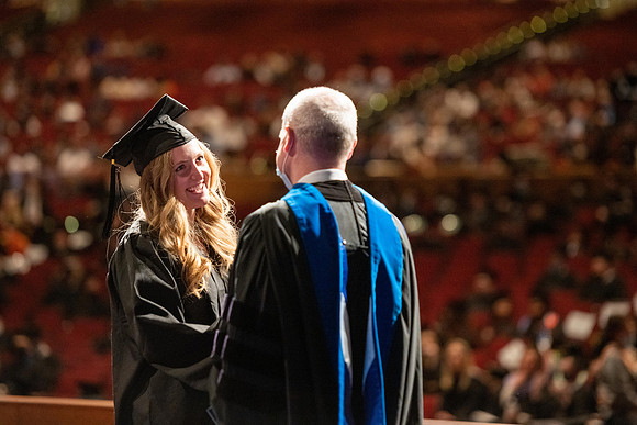 Combined Convocation for the College of Business & Communication and also the College of Physical Sciences & Engineering. Graduates receive their diploma covers.