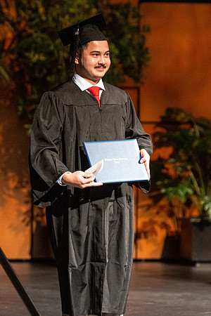 Combined Convocation for the College of Business & Communication and also the College of Physical Sciences & Engineering. Graduates receive their diploma covers.