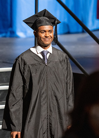 Combined Convocation for the College of Business & Communication and also the College of Physical Sciences & Engineering. Graduates receive their diploma covers.
