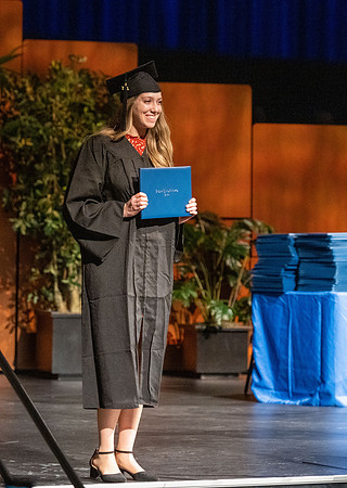 Combined Convocation for the College of Business & Communication and also the College of Physical Sciences & Engineering. Graduates receive their diploma covers.