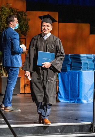 Combined Convocation for the College of Business & Communication and also the College of Physical Sciences & Engineering. Graduates receive their diploma covers.