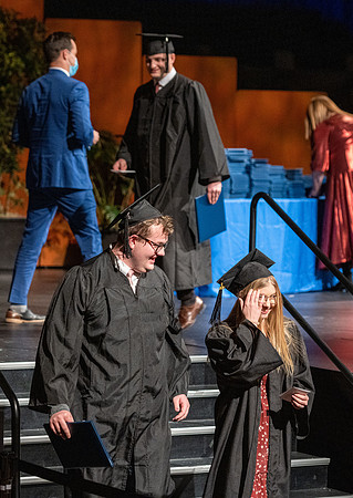 Combined Convocation for the College of Business & Communication and also the College of Physical Sciences & Engineering. Graduates receive their diploma covers.