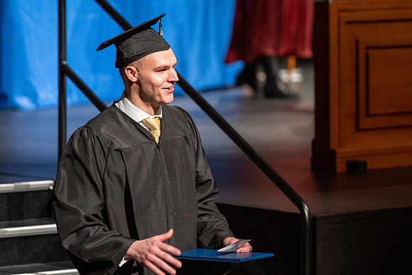 Combined Convocation for the College of Business & Communication and also the College of Physical Sciences & Engineering. Graduates receive their diploma covers.