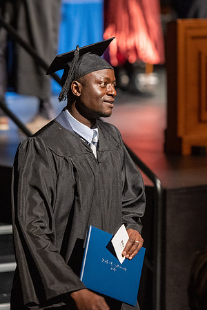 Combined Convocation for the College of Business & Communication and also the College of Physical Sciences & Engineering. Graduates receive their diploma covers.