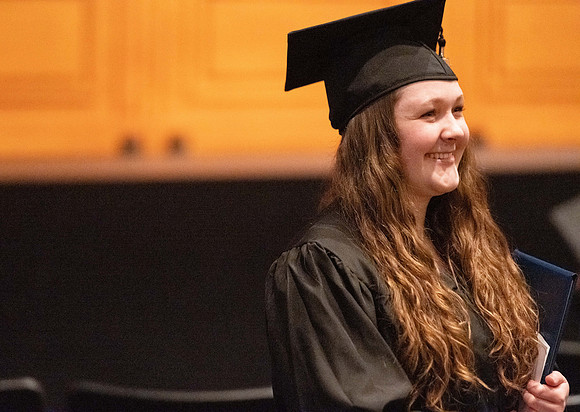 Combined Convocation for the College of Business & Communication and also the College of Physical Sciences & Engineering. Graduates receive their diploma covers.