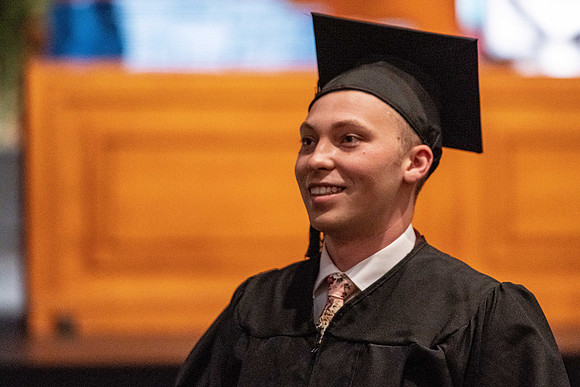 Combined Convocation for the College of Business & Communication and also the College of Physical Sciences & Engineering. Graduates receive their diploma covers.