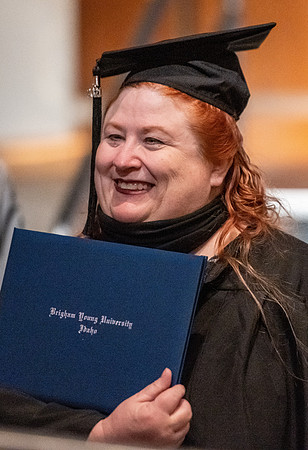 Combined Convocation for the College of Business & Communication and also the College of Physical Sciences & Engineering. Graduates receive their diploma covers.