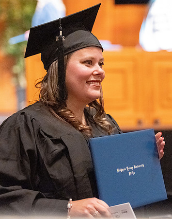 Combined Convocation for the College of Business & Communication and also the College of Physical Sciences & Engineering. Graduates receive their diploma covers.