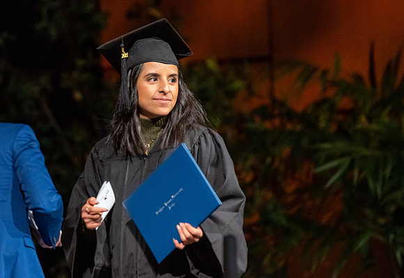Combined Convocation for the College of Business & Communication and also the College of Physical Sciences & Engineering. Graduates receive their diploma covers.