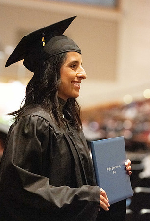 Combined Convocation for the College of Business & Communication and also the College of Physical Sciences & Engineering. Graduates receive their diploma covers.