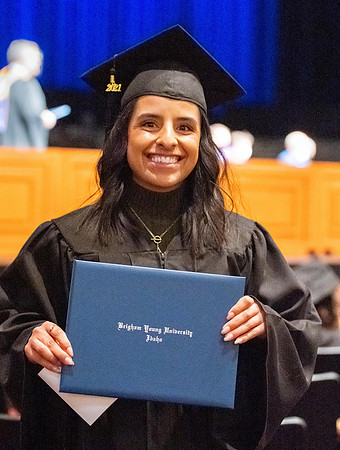Combined Convocation for the College of Business & Communication and also the College of Physical Sciences & Engineering. Graduates receive their diploma covers.