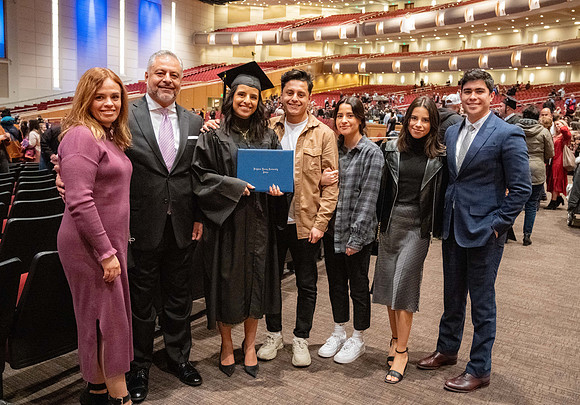 Combined Convocation for the College of Business & Communication and also the College of Physical Sciences & Engineering. Graduates receive their diploma covers.