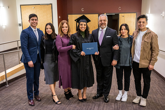 Combined Convocation for the College of Business & Communication and also the College of Physical Sciences & Engineering. Graduates receive their diploma covers.