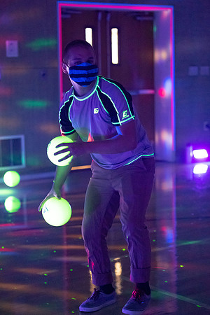Examples of students staying safe and healthy during the COVID-19 pandemic by social distancing, following pathway arrows, and wearing face masks during activities.