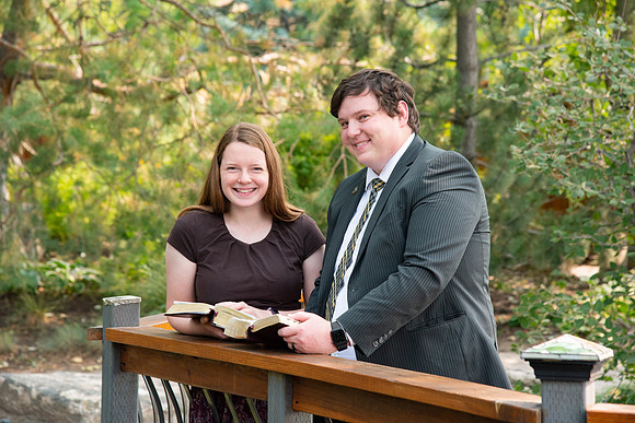 Students reading scriptures on campus.