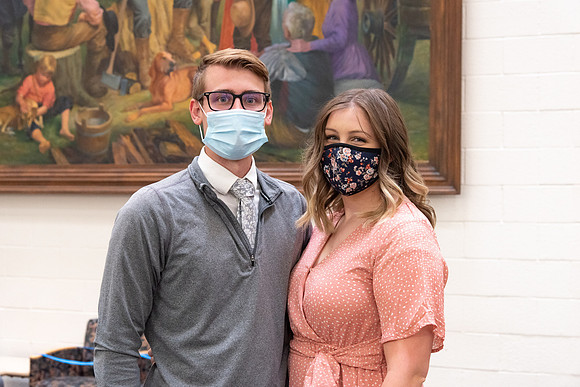 Students wearing face masks at church on campus.