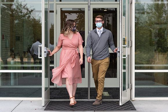 Students wearing face masks at church on campus.